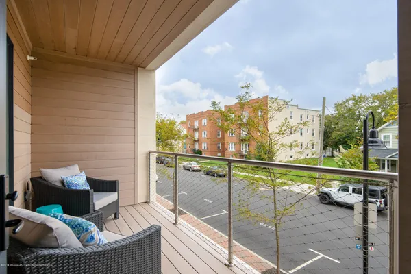 a view of a balcony with furniture