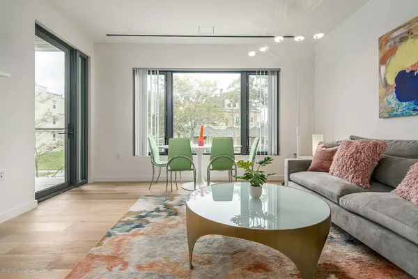 a living room with furniture and a large window