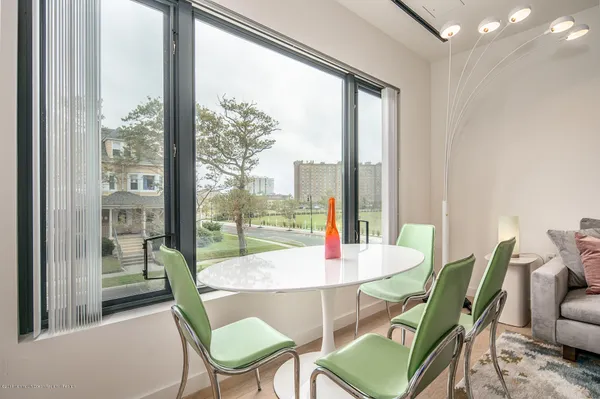 a view of a dining room with furniture window and outside view