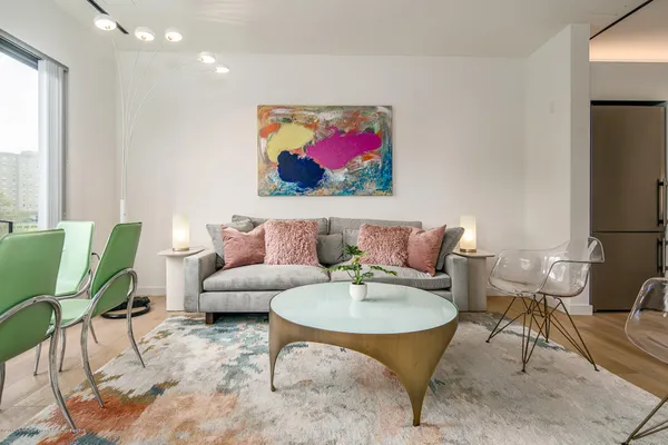 a living room with furniture and a rug