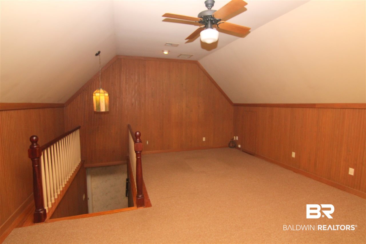 7147 Chapman Street Fairhope, AL 36532 - Photo 19 of 48 Sep. from other BRs. Hardwood floors under rug.