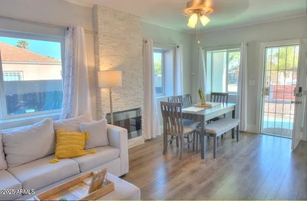a view of a dining room with furniture and wooden floor