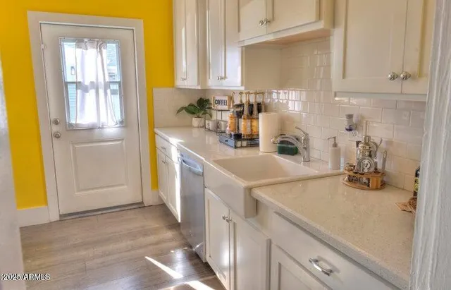 a kitchen with a sink and cabinets