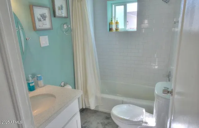 a bathroom with a sink and toilet