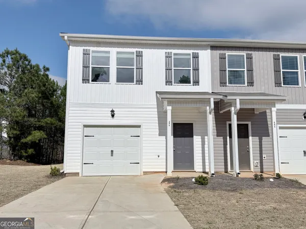 a front view of a house with stairs