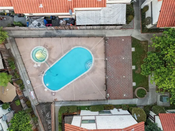 an aerial view of a house with swimming pool