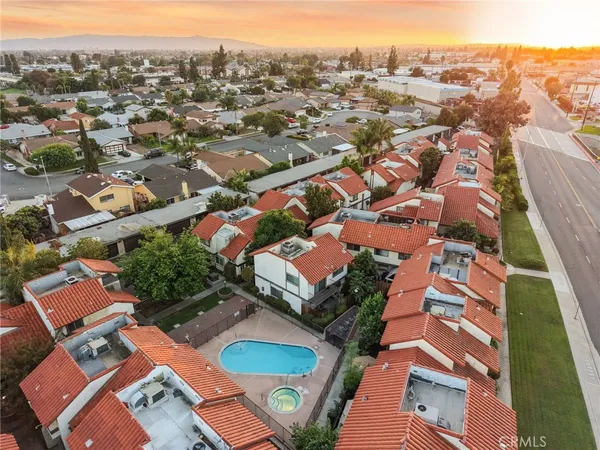 an aerial view of residential houses with outdoor space