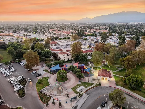 a view of a swimming pool with a chair and tables in the patio
