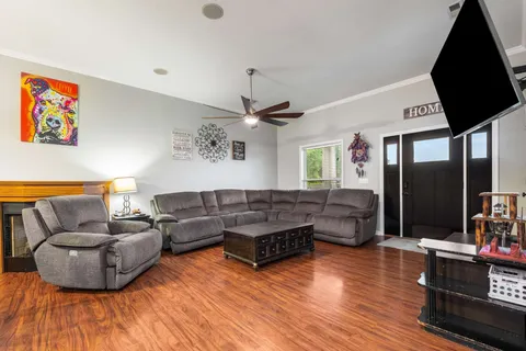 a living room with furniture and a flat screen tv