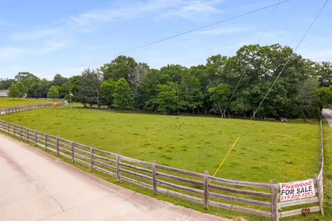 a view of a field with an outdoor space