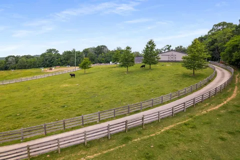 a view of a lake with a yard