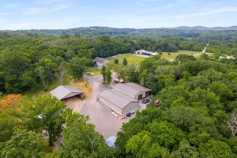 an aerial view of a house with mountain view