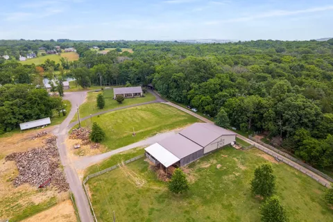 a view of a pool with a yard