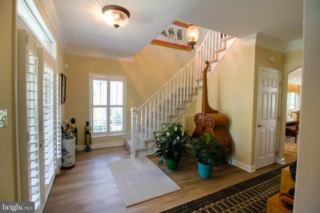 a kitchen with a stove and wooden floor
