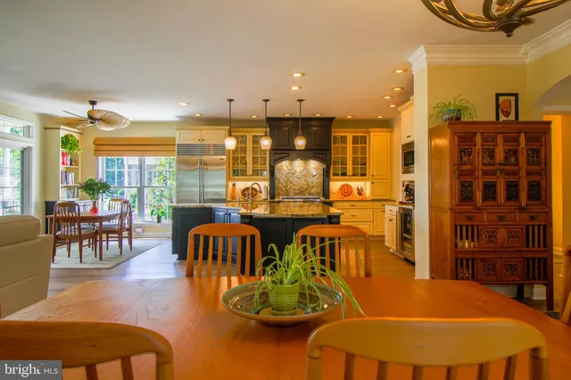 a kitchen with cabinets and a wooden floor
