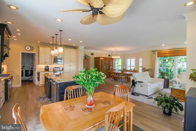 a view of a chair and table on the deck