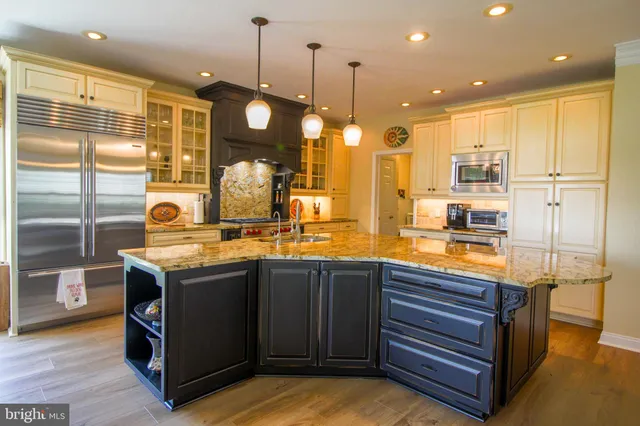 a bathroom with a sink a mirror and a shower