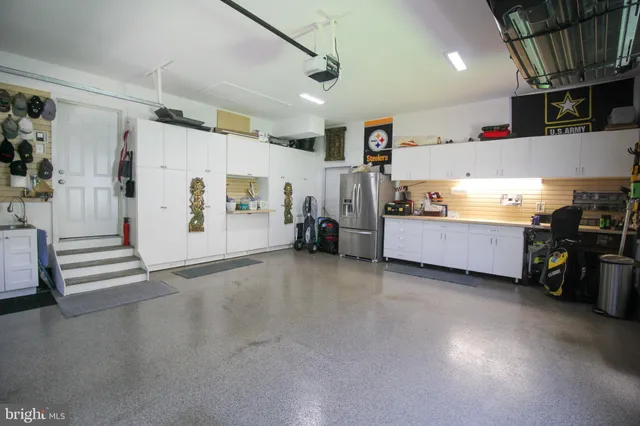 a living room with furniture and a lamp