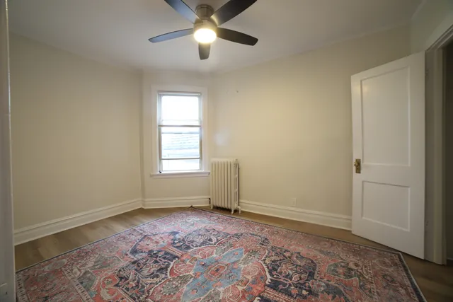 a view of room with window and ceiling fan