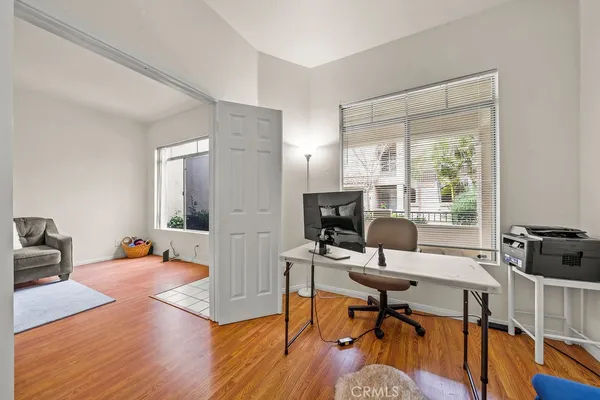 a workspace with furniture hardwood and a window
