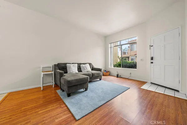 a living room with furniture and a large window