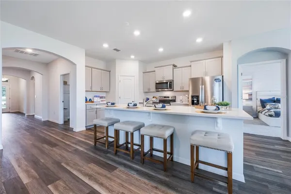 a kitchen with appliances and cabinets