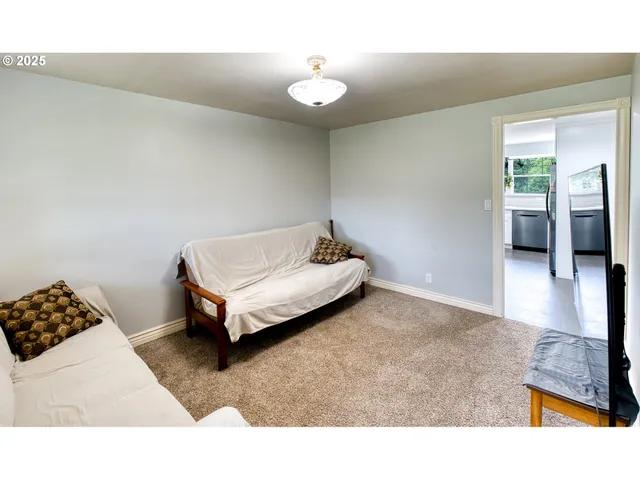 a living room with a couch and a view of living room