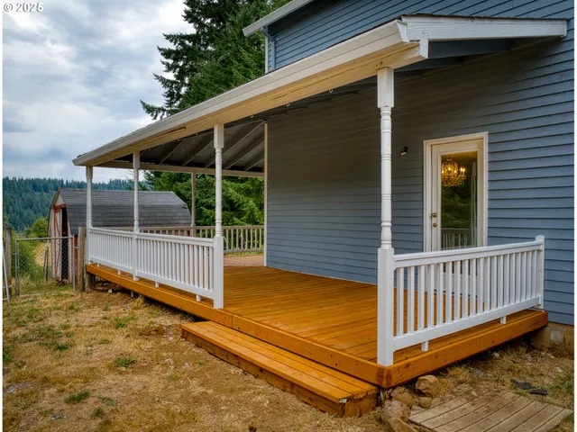 a view of porch with wooden floor