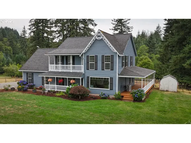 a front view of a house with a yard table and chairs