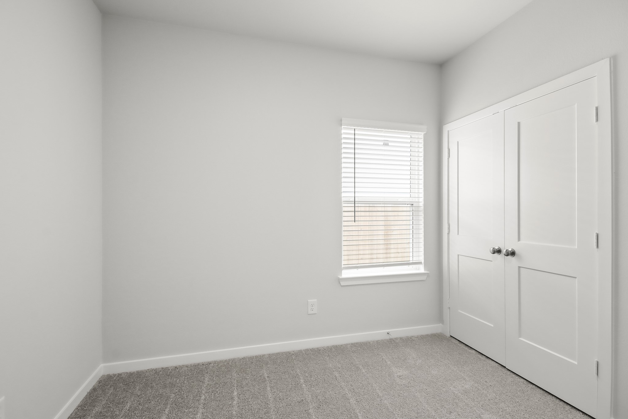 225 Spring Drive Hockley, TX 77447 - Photo 14 of 24 a view of an empty room with a window