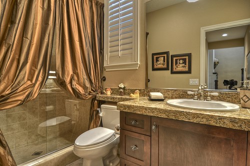 10 Prescott Aliso Viejo, CA 92656 - Photo 14 of 29 a bathroom with a granite countertop sink toilet and a mirror