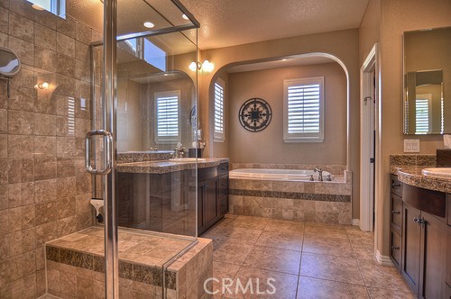 10 Prescott Aliso Viejo, CA 92656 - Photo 20 of 29 a bathroom with a tub and mirror