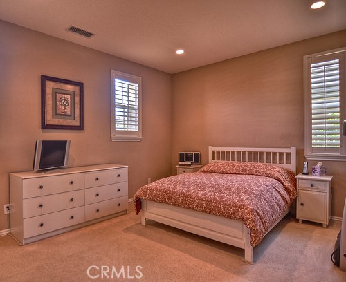 10 Prescott Aliso Viejo, CA 92656 - Photo 22 of 29 a bedroom with a bed and a night stand