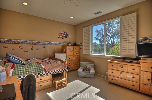 10 Prescott Aliso Viejo, CA 92656 - Photo 24 of 29 a bedroom with furniture and a flat screen tv