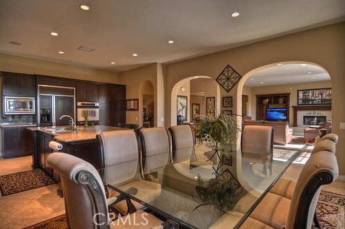 10 Prescott Aliso Viejo, CA 92656 - Photo 5 of 29 a living room with furniture a large window and a dining table