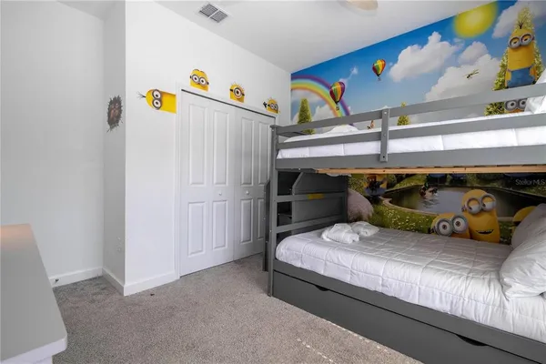 a kitchen with stainless steel appliances granite countertop a stove a sink a microwave a dining table and chairs