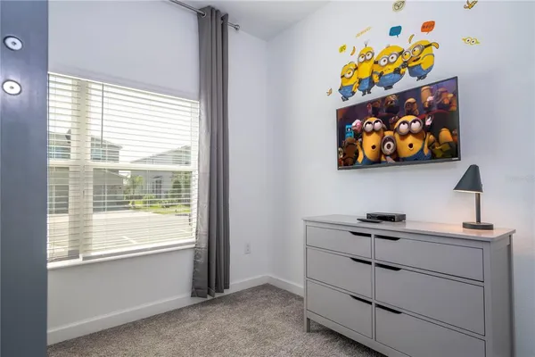 a kitchen with stainless steel appliances kitchen island granite countertop a refrigerator and a stove top oven