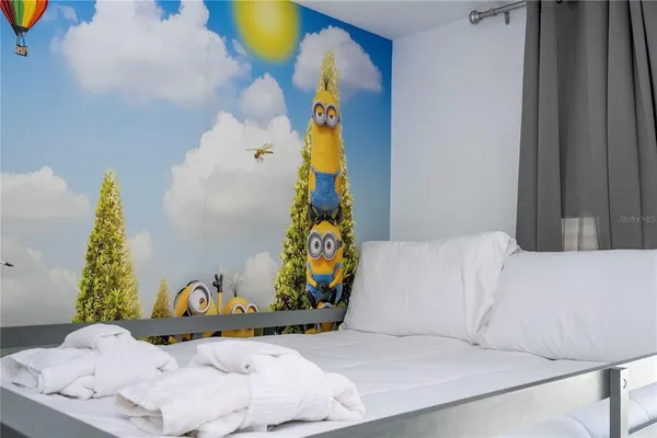 a kitchen with stainless steel appliances granite countertop a sink and a stove top oven with wooden floor