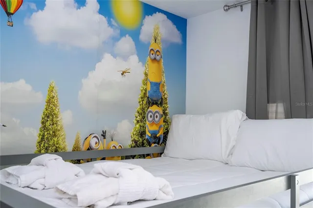 a kitchen with stainless steel appliances granite countertop a sink and a stove top oven with wooden floor