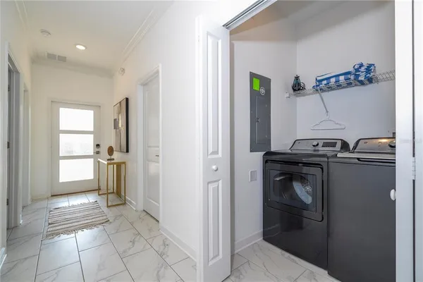 a bedroom with a bed and a lamp with window