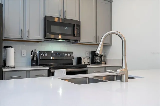 a bedroom with bed and a large window