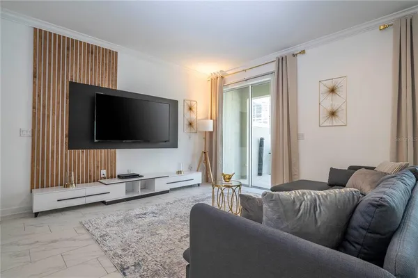 a bedroom with a large bed and a couch