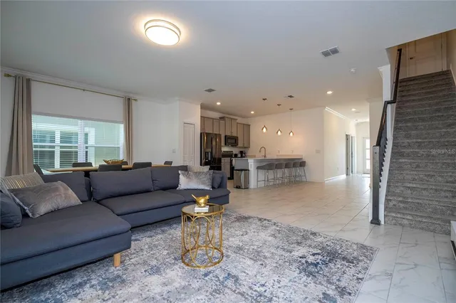 a view of a balcony with table and chairs