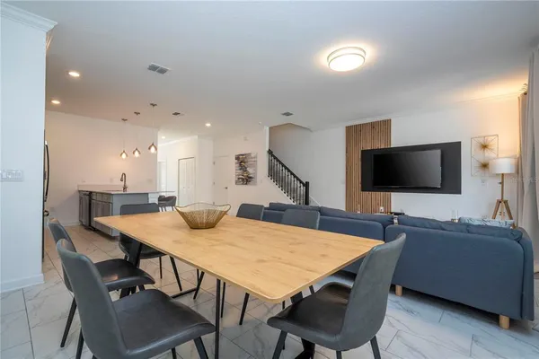 a view of a swimming pool with a patio and a garden