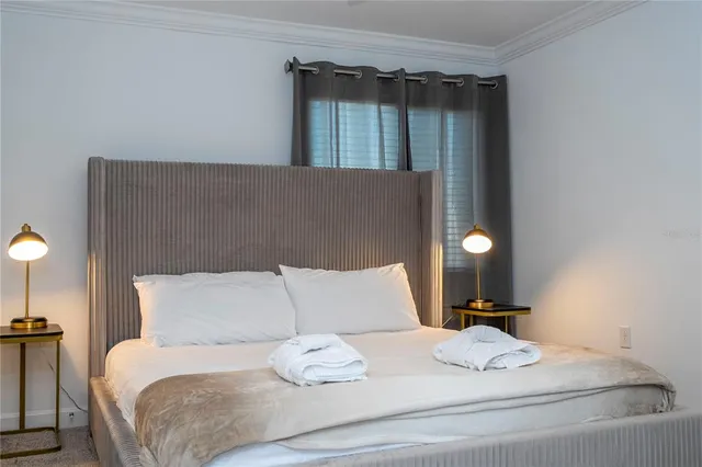 a front view of a house with a yard garage and outdoor seating