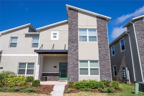 a bedroom with a bed and a mirror