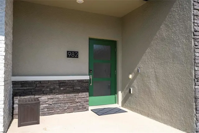 a bed room with a bed and a balcony