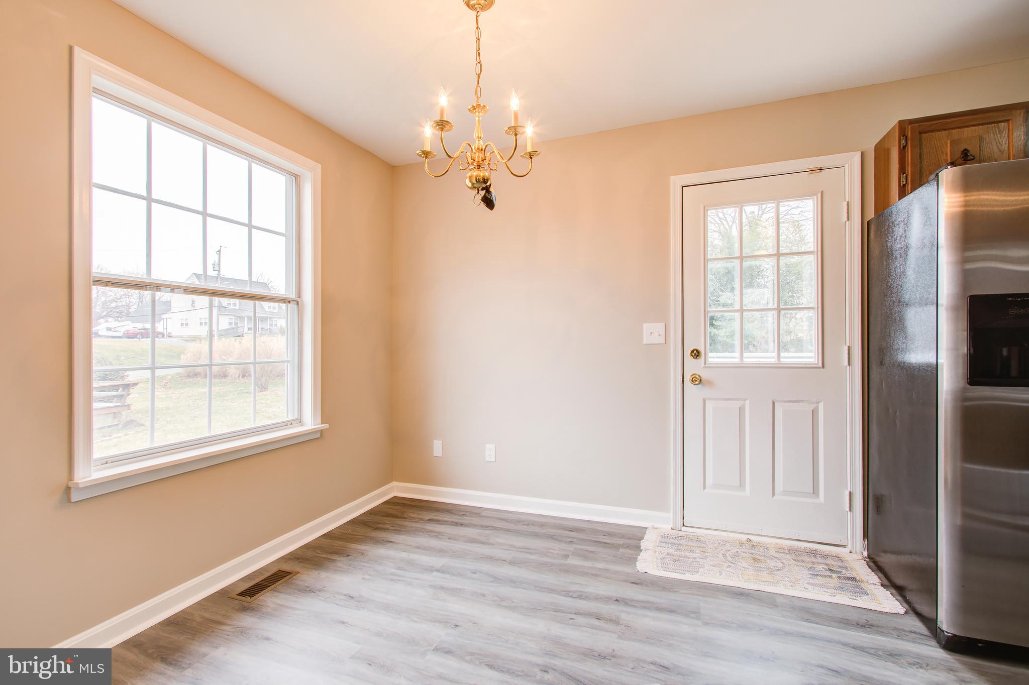 7503 Plainview Road Baltimore, MD 21237 - Photo 11 of 39 "Solid Brass Light Fixture & Door to the Deck"