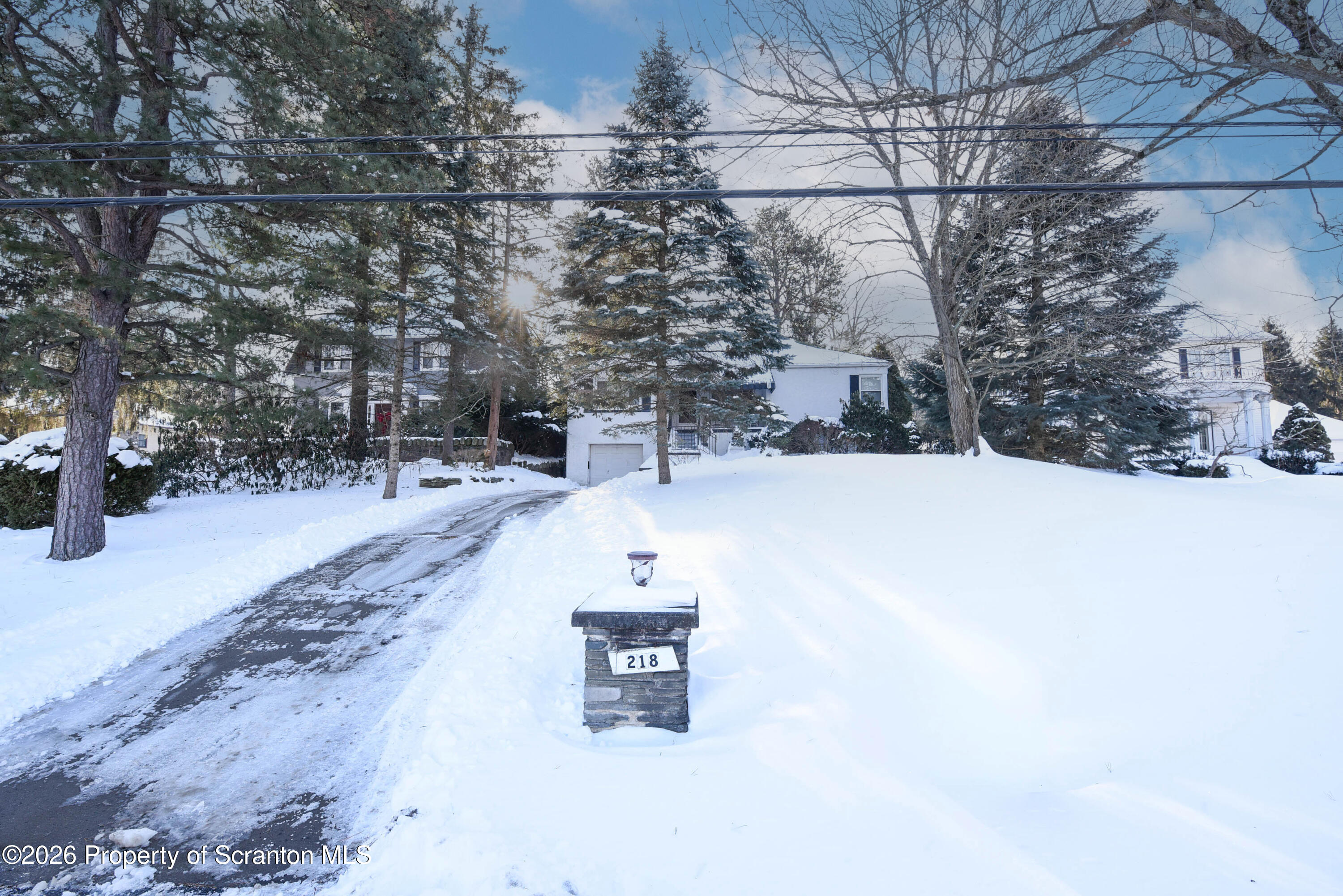218 Lake Scranton Road Scranton, PA 18505 - Photo 2 of 45 a view of a road with a snow on the road