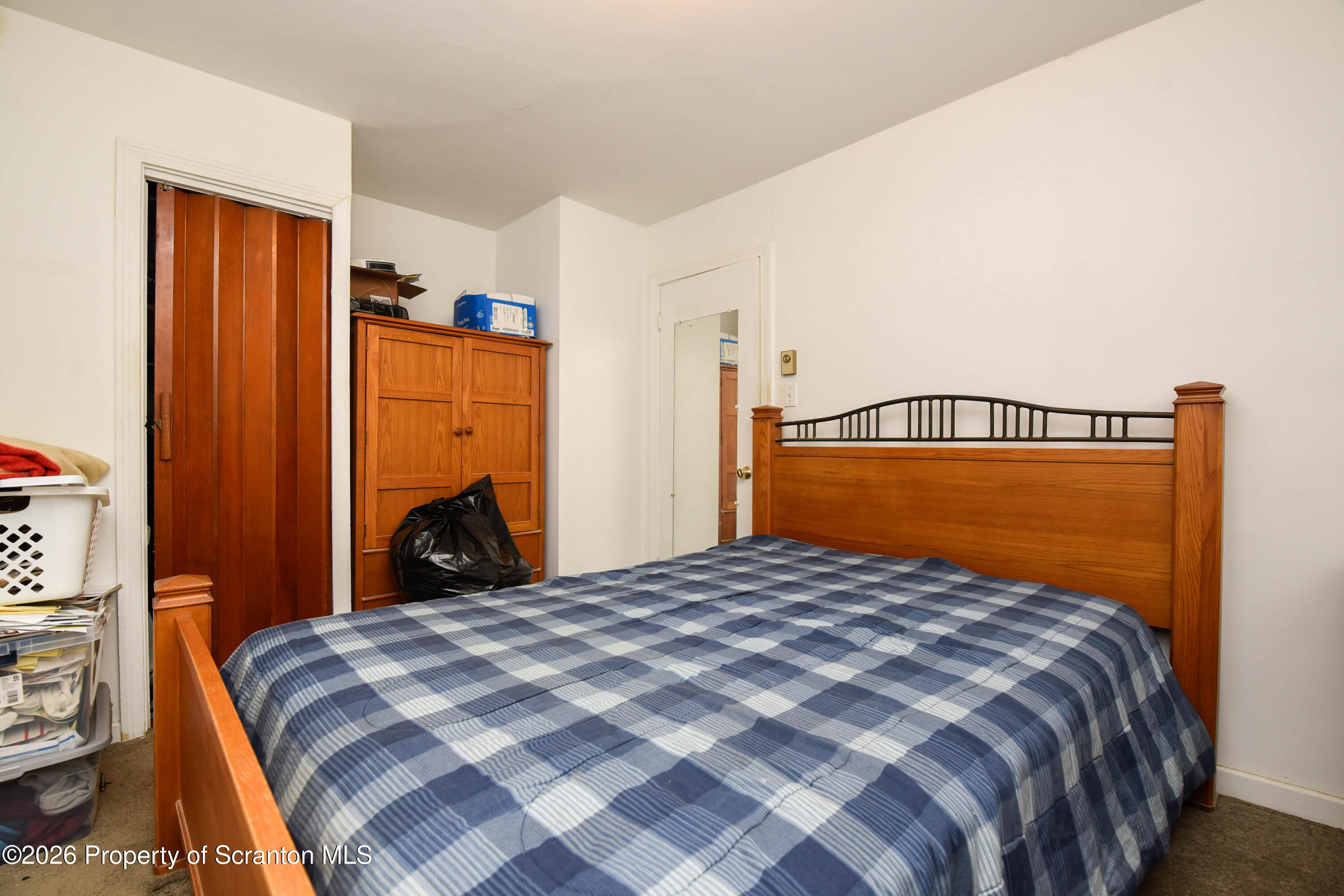 218 Lake Scranton Road Scranton, PA 18505 - Photo 28 of 45 a bedroom with a bed and a lamp on dresser